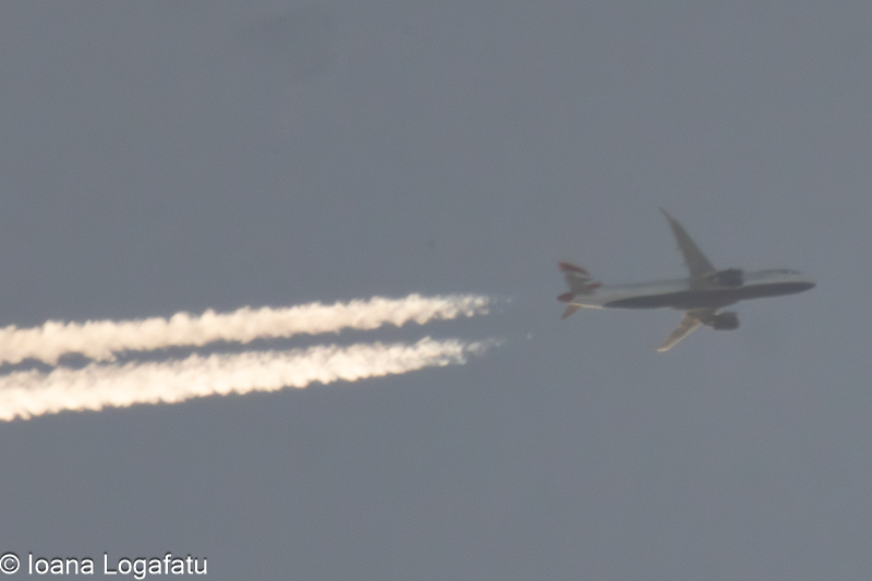 Plane soaring through cloudy skies
